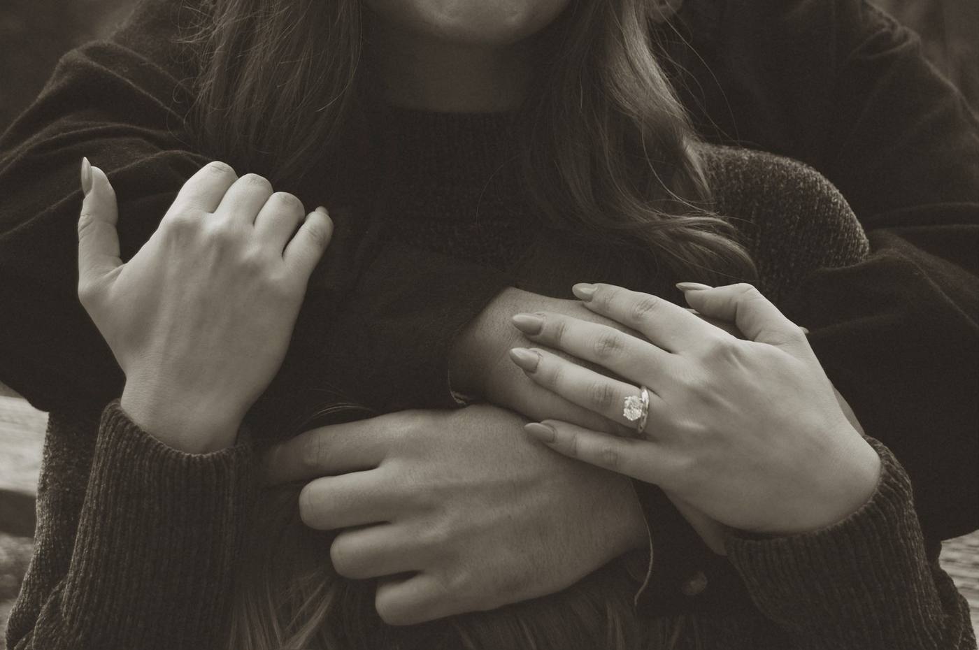 Engaged couple holding hands in Yosemite