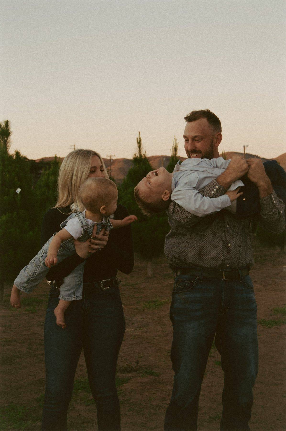 Family walking together through open fields